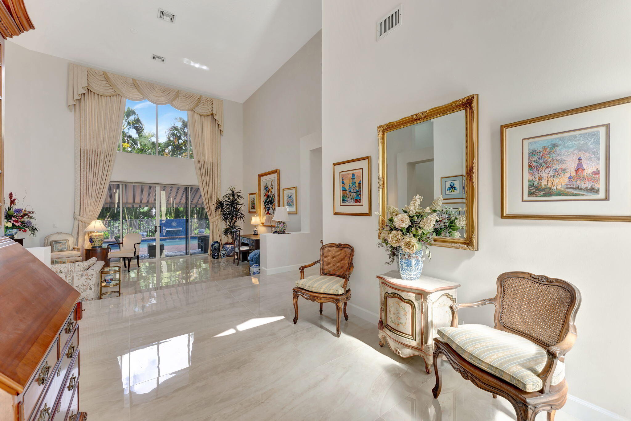 6039 Northwest 31st Terrace Boca Raton, FL 33496 - Photo 12 of 70 a living room with furniture and a large window
