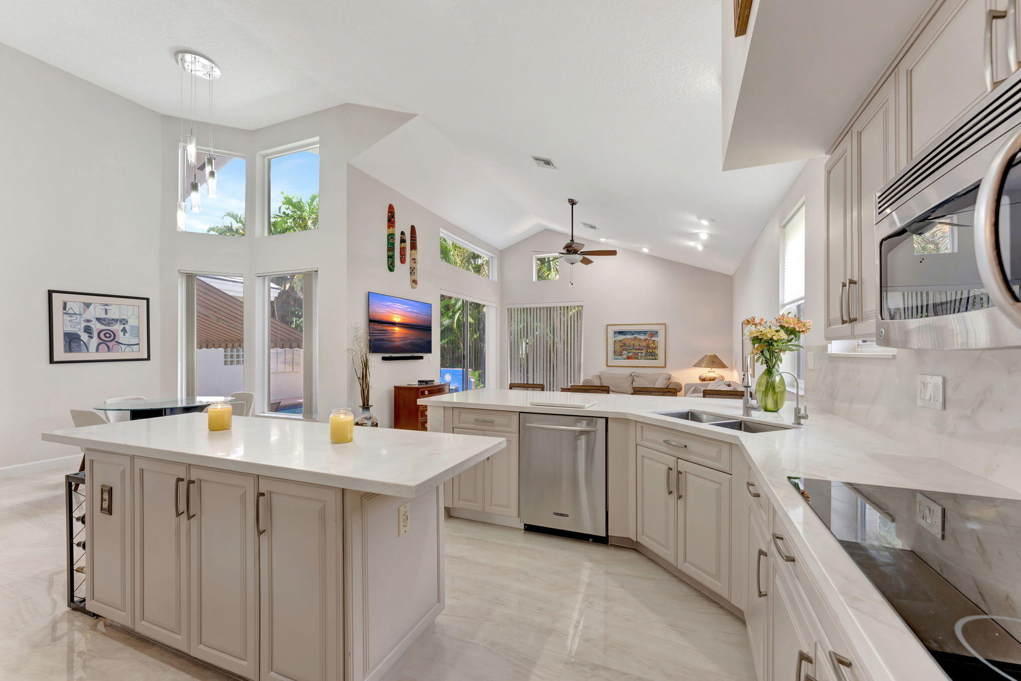 6039 Northwest 31st Terrace Boca Raton, FL 33496 - Photo 17 of 70 a kitchen with cabinets a sink and appliances