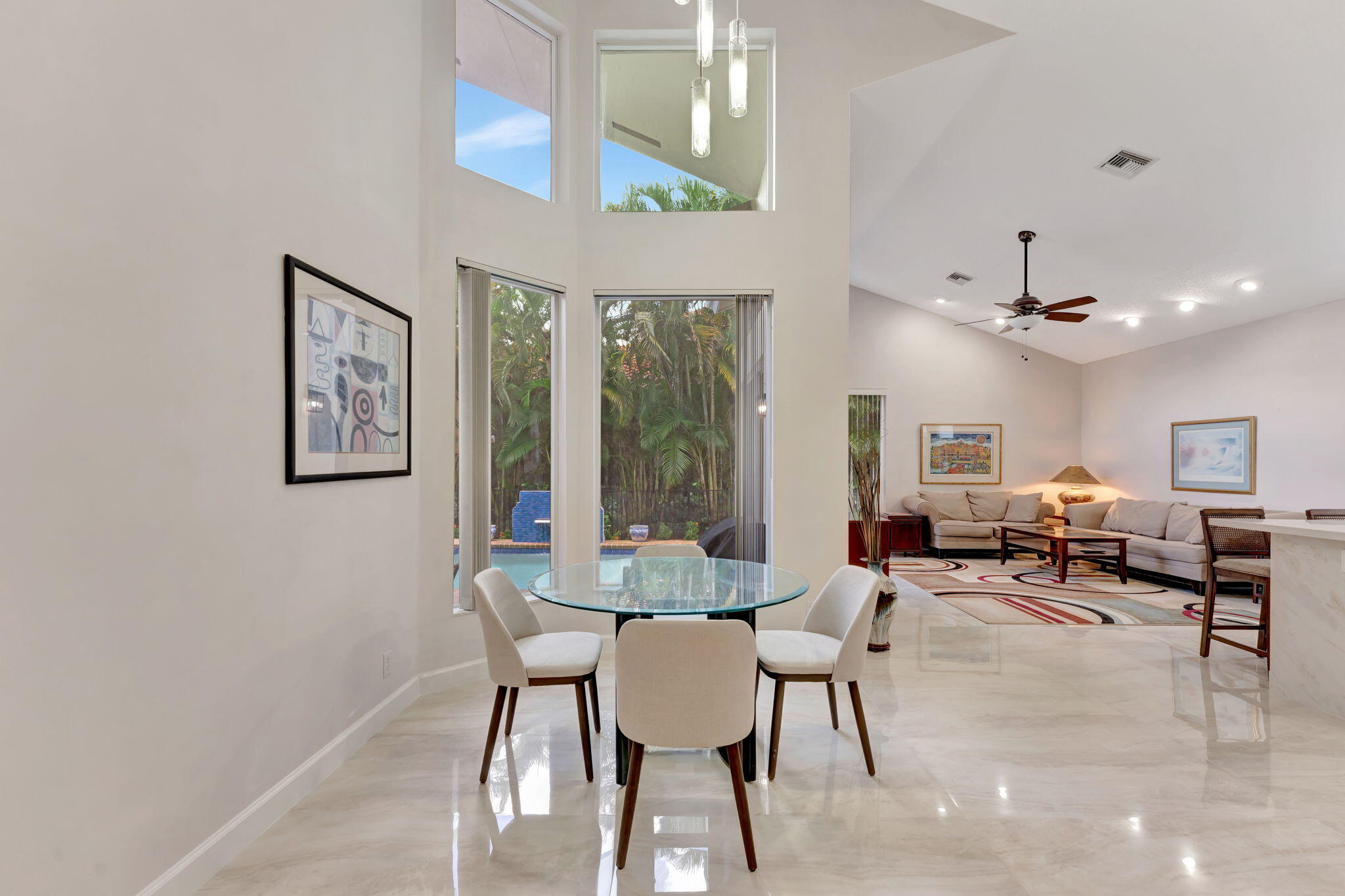6039 Northwest 31st Terrace Boca Raton, FL 33496 - Photo 25 of 70 a view of a dining room with furniture window and outside view