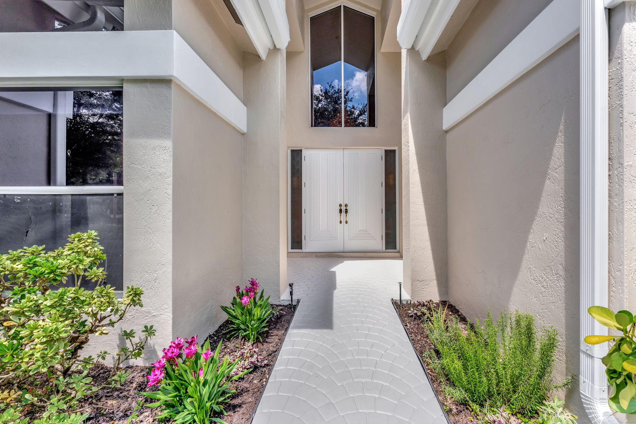 6039 Northwest 31st Terrace Boca Raton, FL 33496 - Photo 3 of 70 a vase with flowers sitting on a floor in front of a window