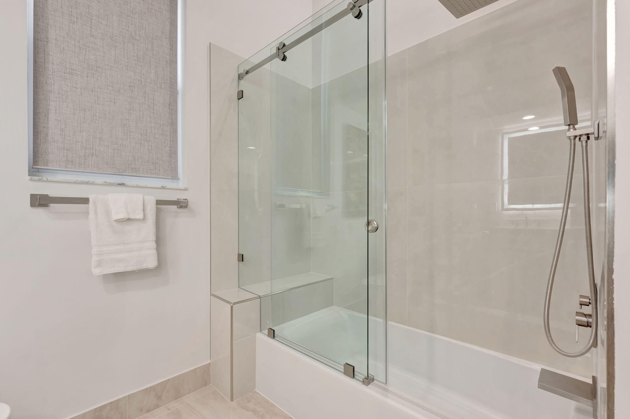 6039 Northwest 31st Terrace Boca Raton, FL 33496 - Photo 37 of 70 a white bath tub sitting next to a shower