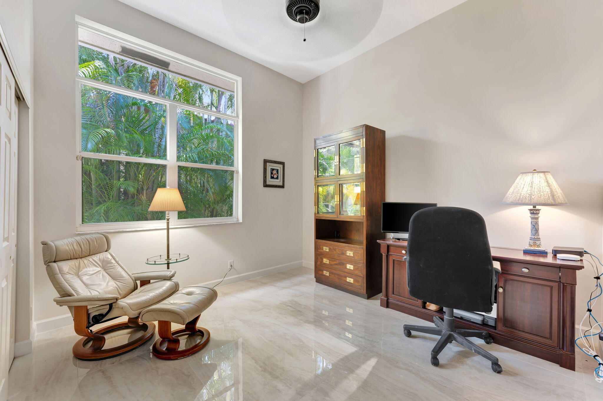 6039 Northwest 31st Terrace Boca Raton, FL 33496 - Photo 38 of 70 a view of a workspace with furniture and a window
