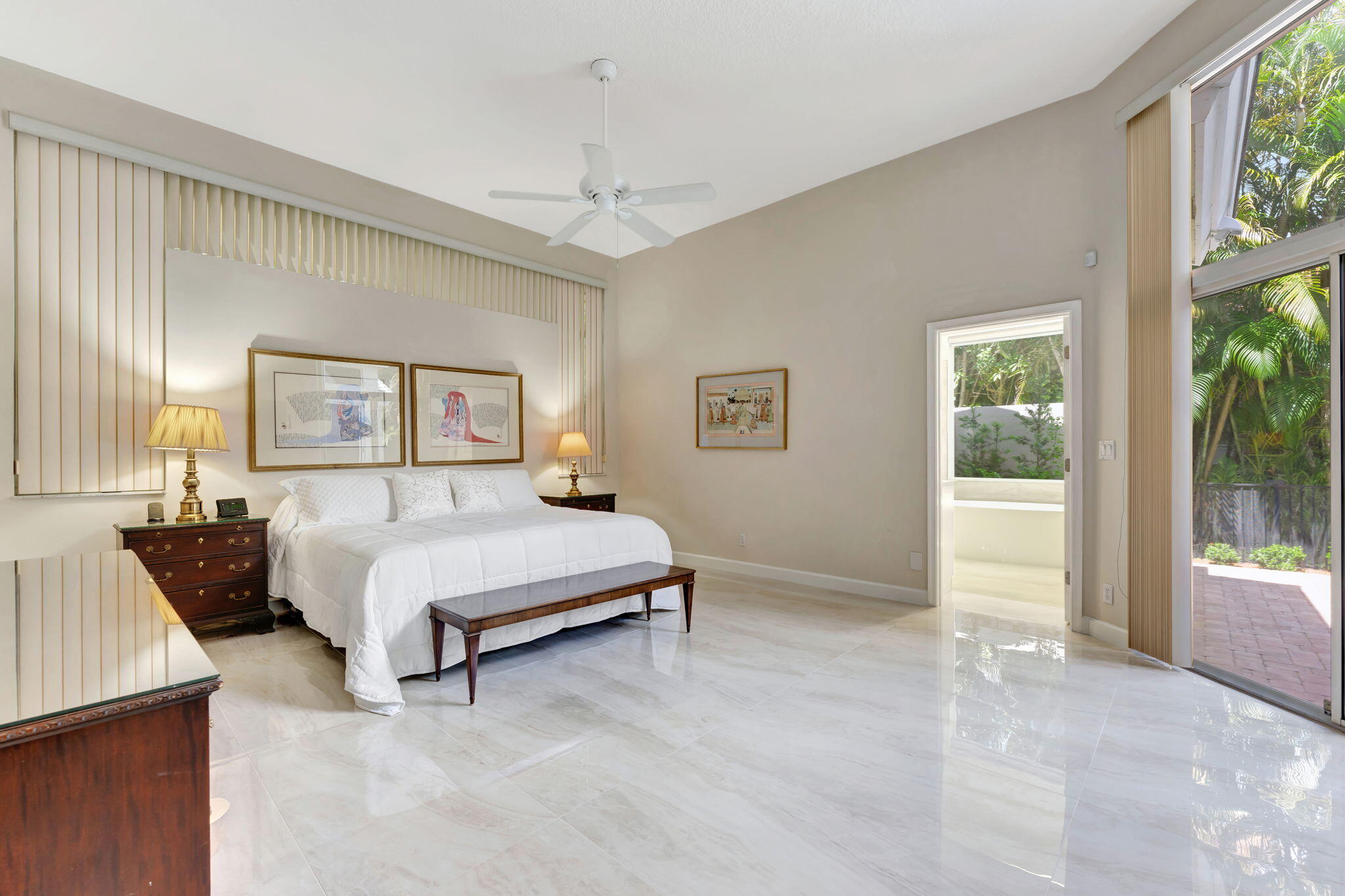 6039 Northwest 31st Terrace Boca Raton, FL 33496 - Photo 41 of 70 a spacious bedroom with a bed and a window