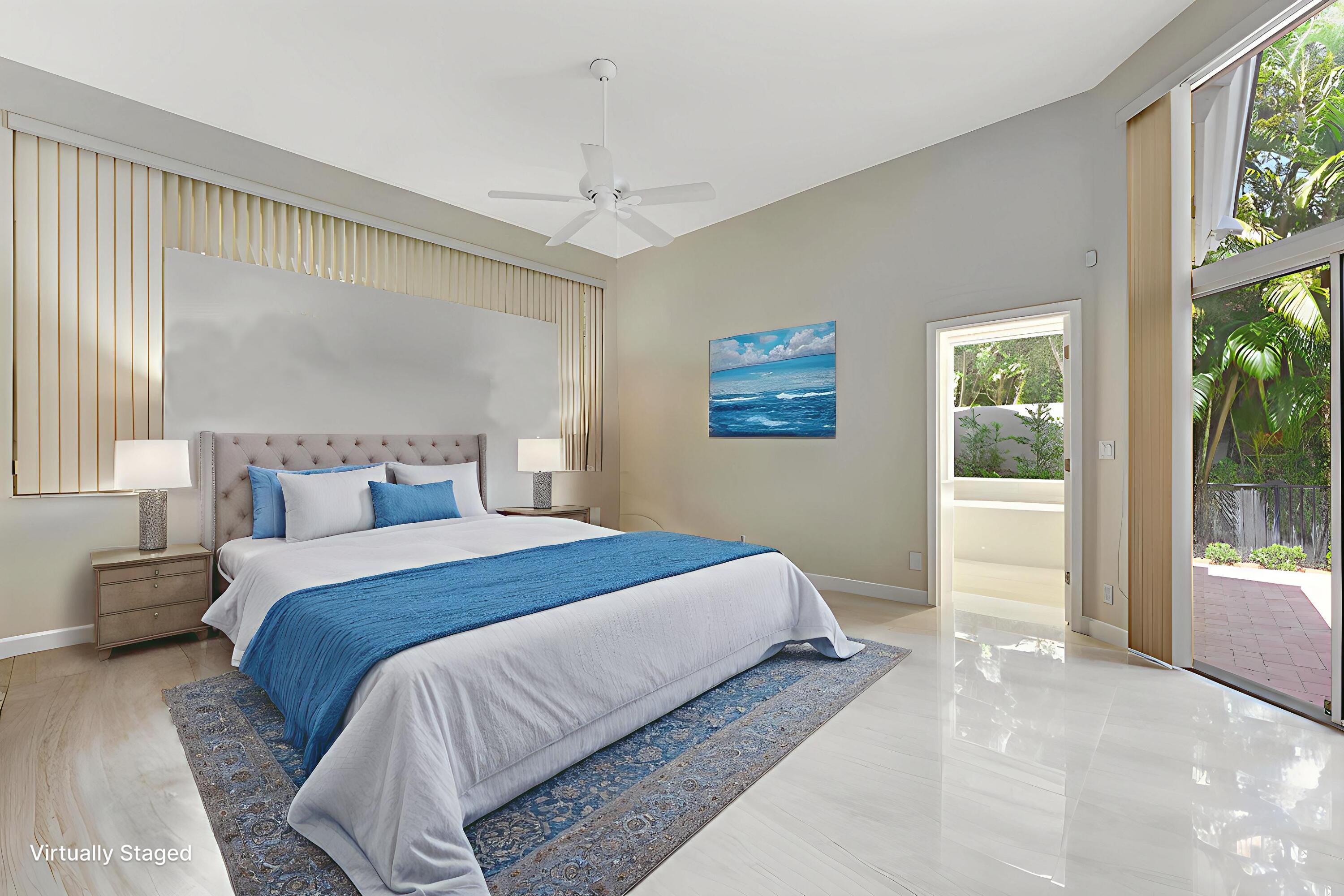 6039 Northwest 31st Terrace Boca Raton, FL 33496 - Photo 42 of 70 a bedroom with a large bed and a window