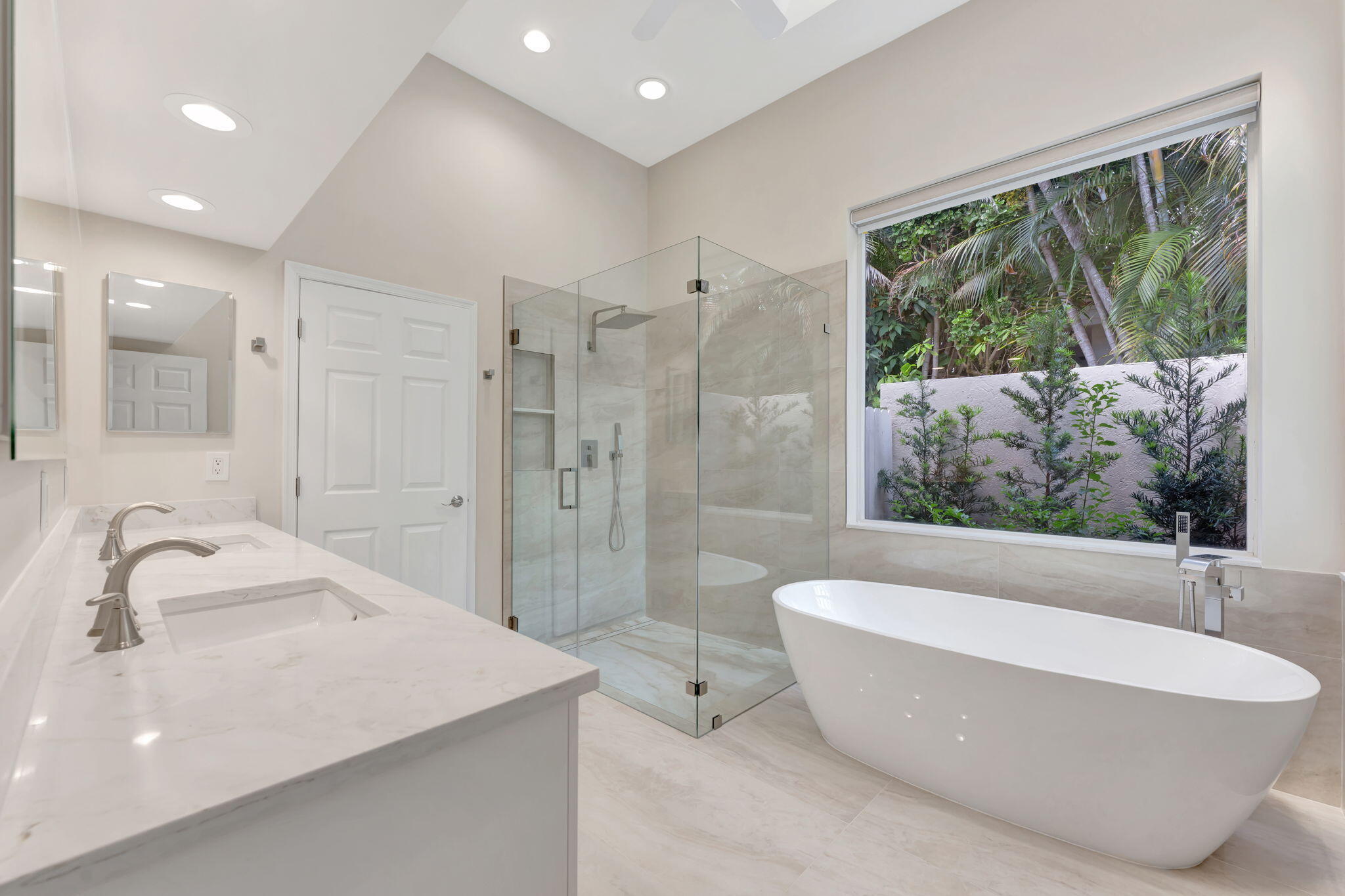 6039 Northwest 31st Terrace Boca Raton, FL 33496 - Photo 46 of 70 a bathroom with a bathtub and a sink