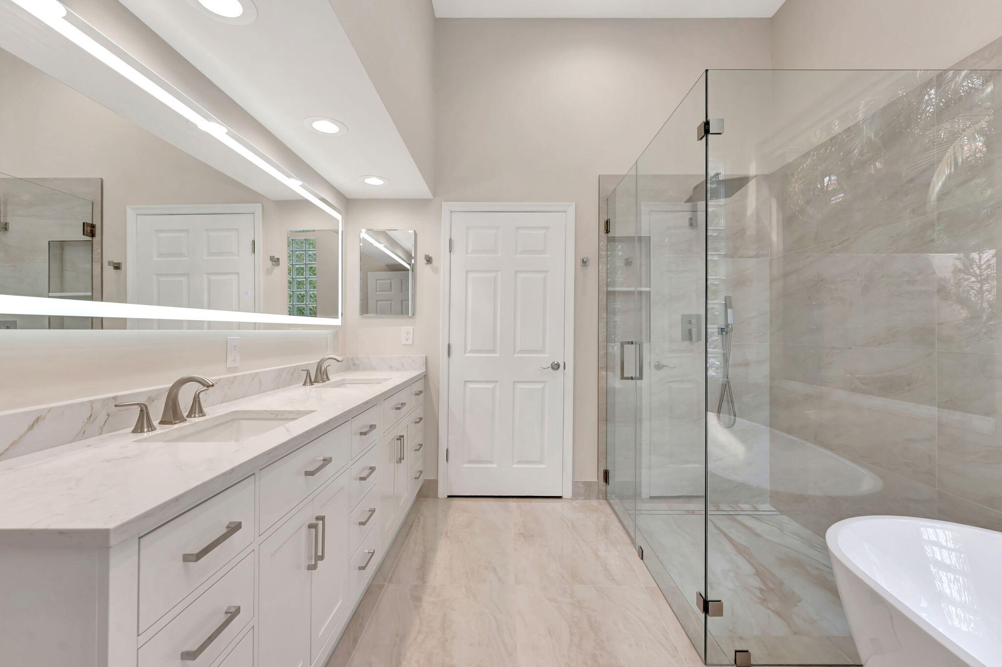6039 Northwest 31st Terrace Boca Raton, FL 33496 - Photo 47 of 70 a bathroom with a double vanity sink toilet mirror and shower