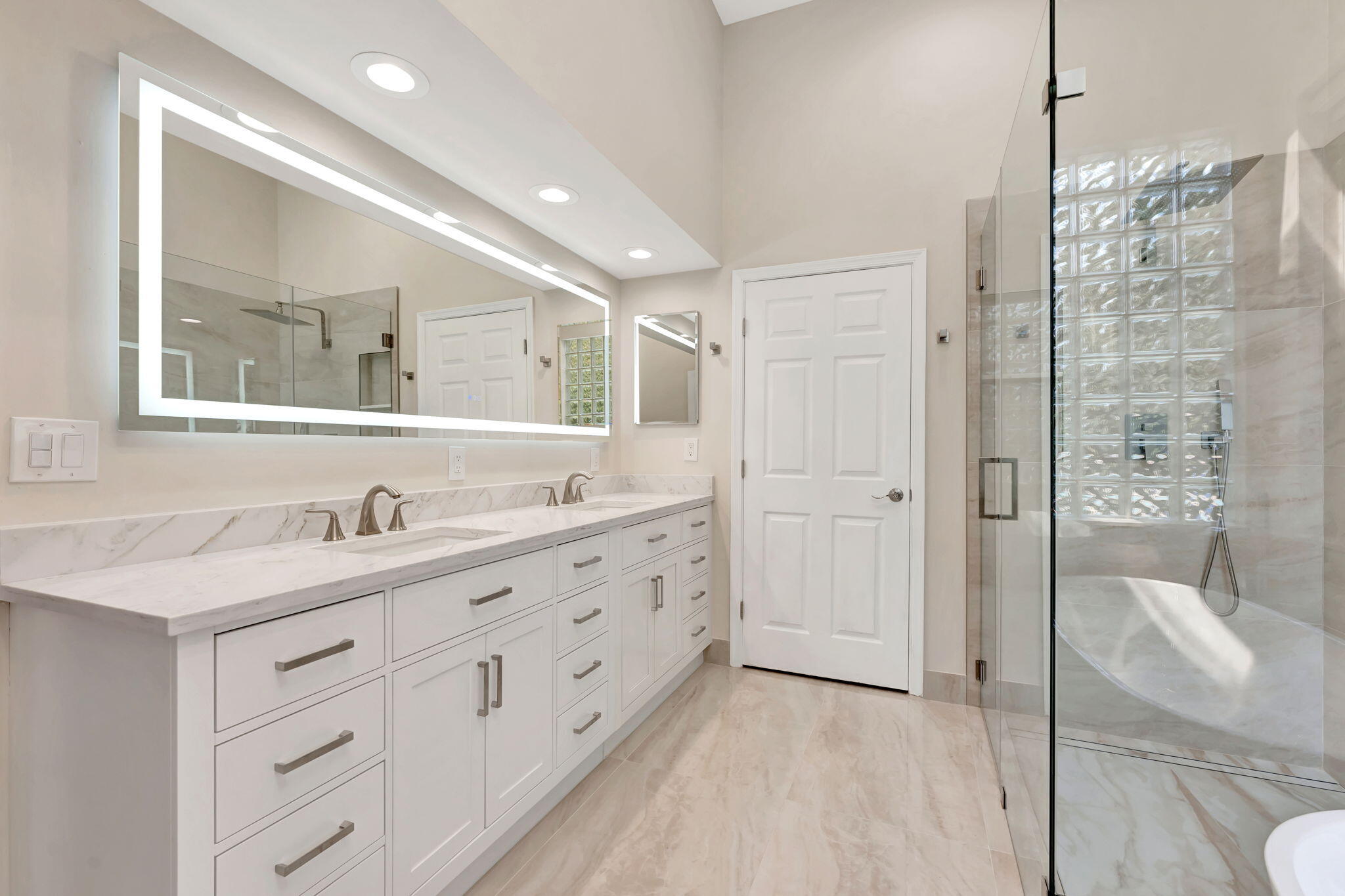 6039 Northwest 31st Terrace Boca Raton, FL 33496 - Photo 49 of 70 a bathroom with a double vanity sink mirror and shower