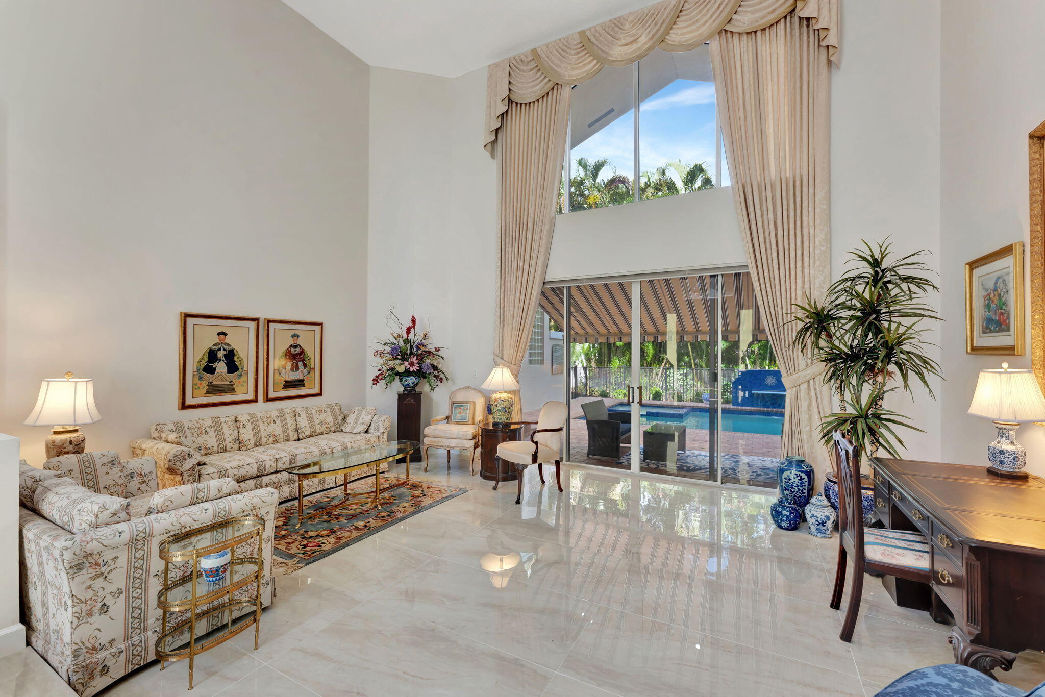 6039 Northwest 31st Terrace Boca Raton, FL 33496 - Photo 5 of 70 a living room with furniture large window and a potted plants