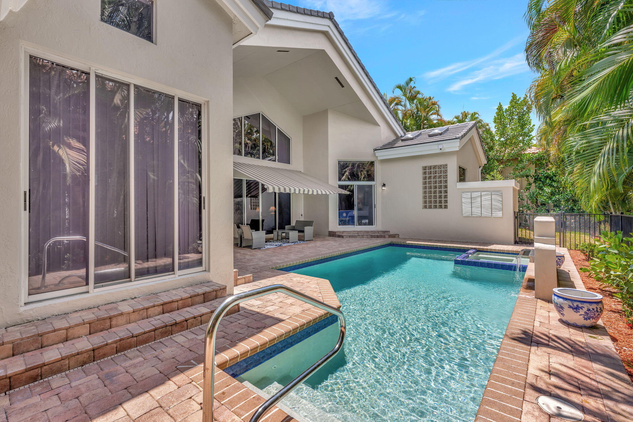 6039 Northwest 31st Terrace Boca Raton, FL 33496 - Photo 61 of 70 a view of a house with backyard porch and sitting area