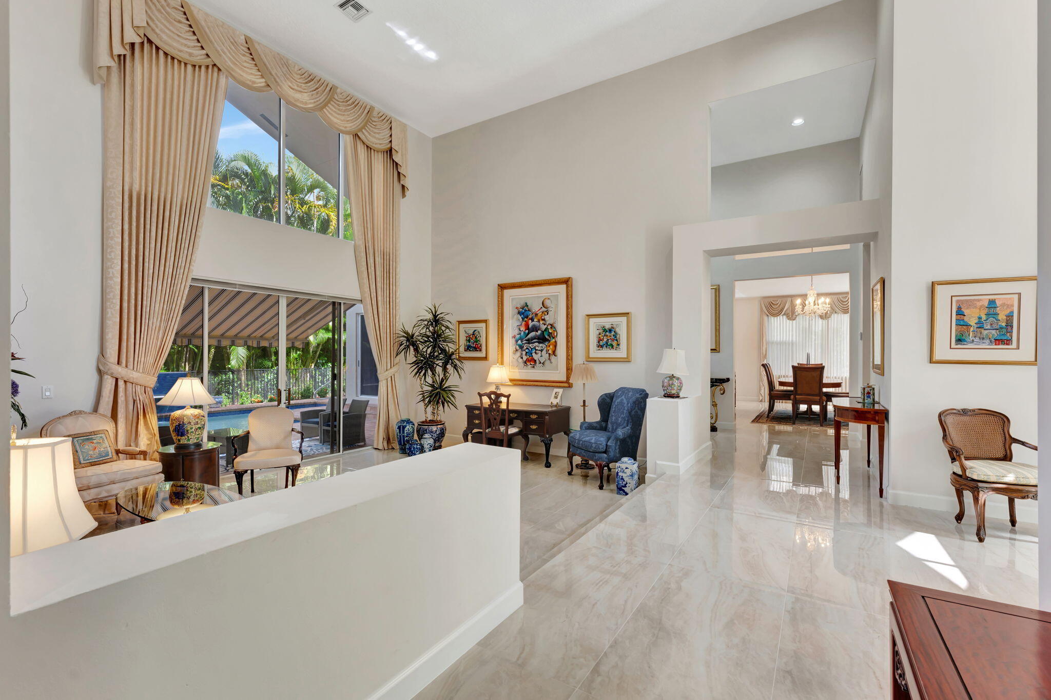 6039 Northwest 31st Terrace Boca Raton, FL 33496 - Photo 9 of 70 a living room with furniture large window and wooden floor