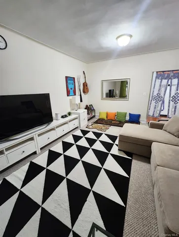 a living room with a black white checkered floor with black white checkered floor