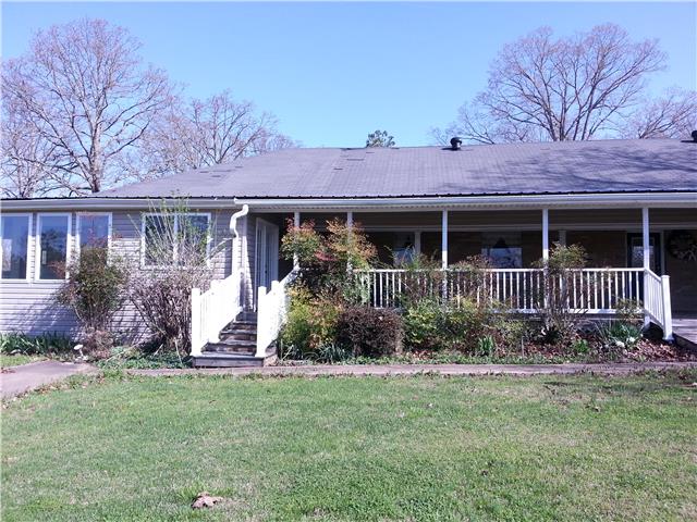 2792 Grays Bend Road Centerville, TN 37033 - Photo 1 of 14 a view of a house with brick walls and a yard with plants
