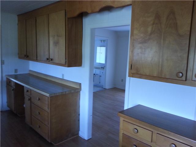 2792 Grays Bend Road Centerville, TN 37033 - Photo 12 of 14 a kitchen with granite countertop cabinets and fireplace