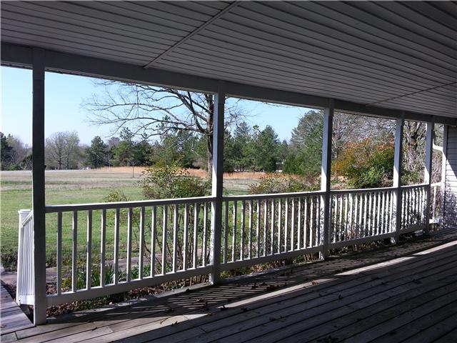 2792 Grays Bend Road Centerville, TN 37033 - Photo 4 of 14 a view of a wooden deck next to a yard