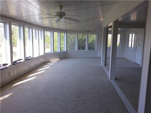 2792 Grays Bend Road Centerville, TN 37033 - Photo 8 of 14 a view of an empty room with a fireplace and a large window