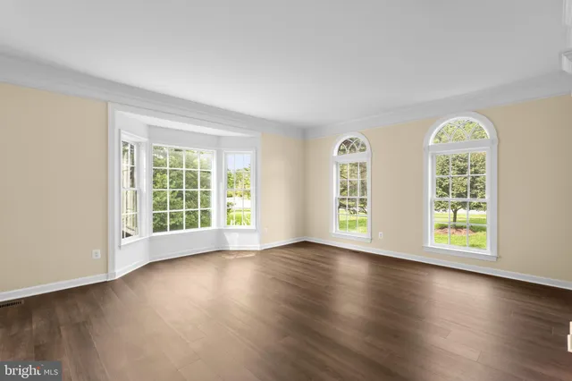 a view of a kitchen cabinets and wooden floor