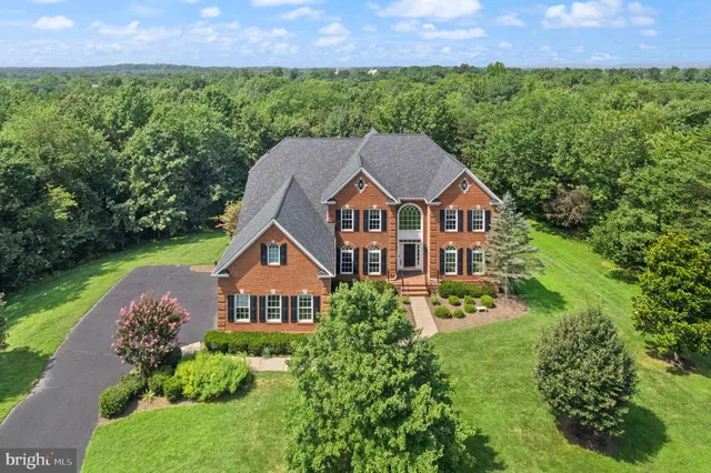 a view of entryway with wooden floor and stairs