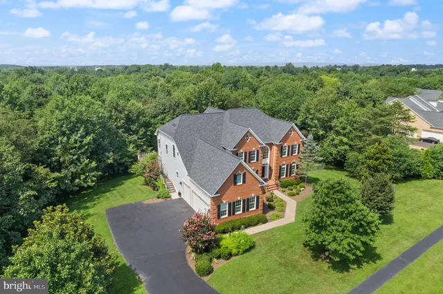 a view of room with window and wooden floor