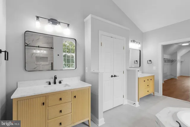 a front view of a house with yard and green space