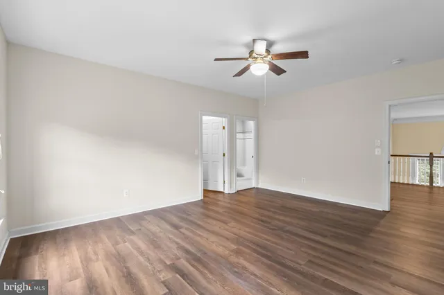 a view of a city with lush green forest