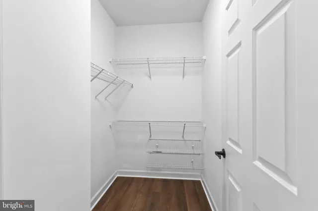 a view of a garden with a building in the background