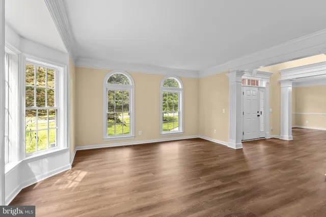 a large kitchen with stainless steel appliances granite countertop a large counter top and a stove