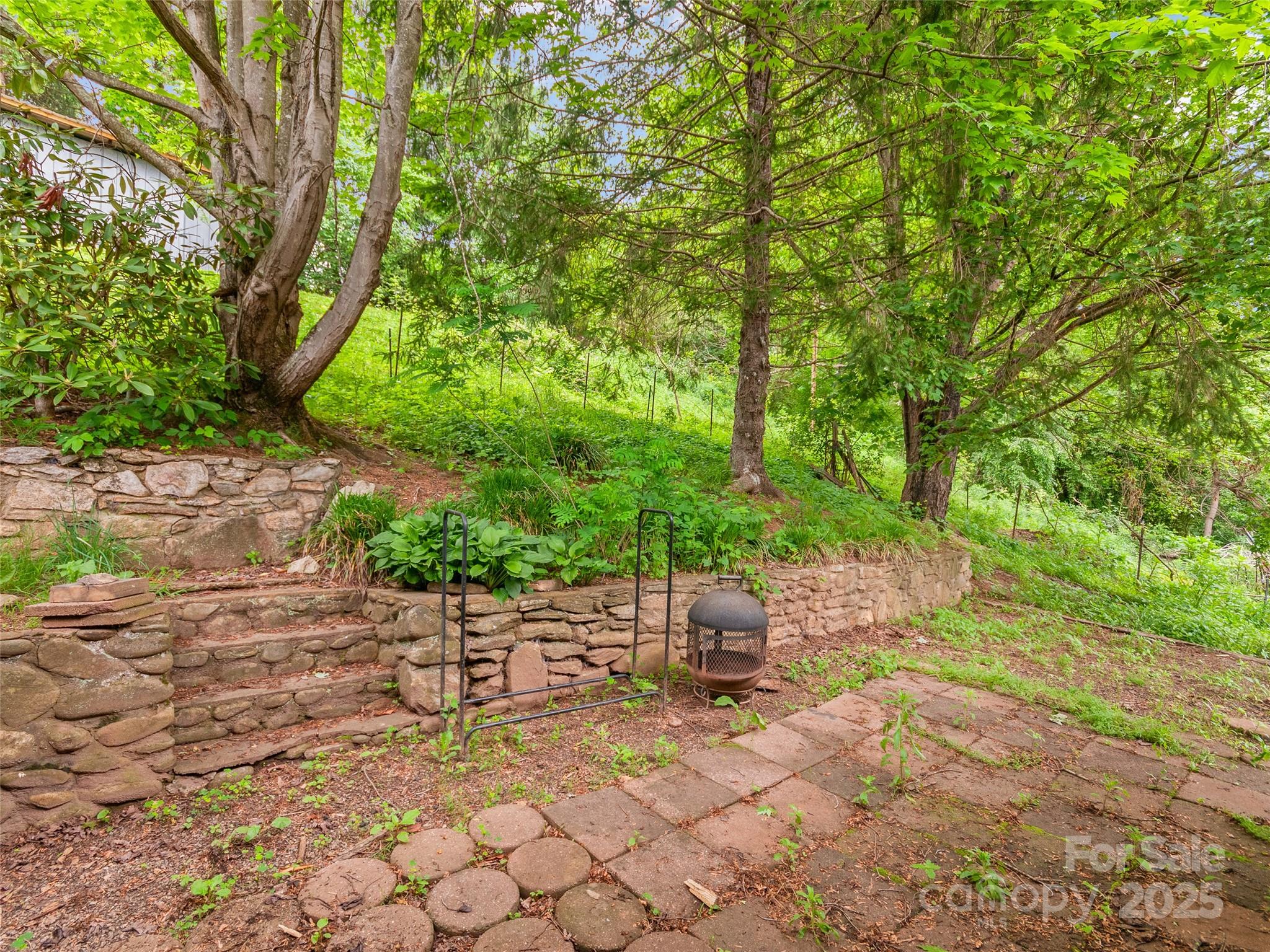 49 Caring Pl Loop Clyde, NC 28721 - Photo 17 of 18 a view of an chairs and fire pit