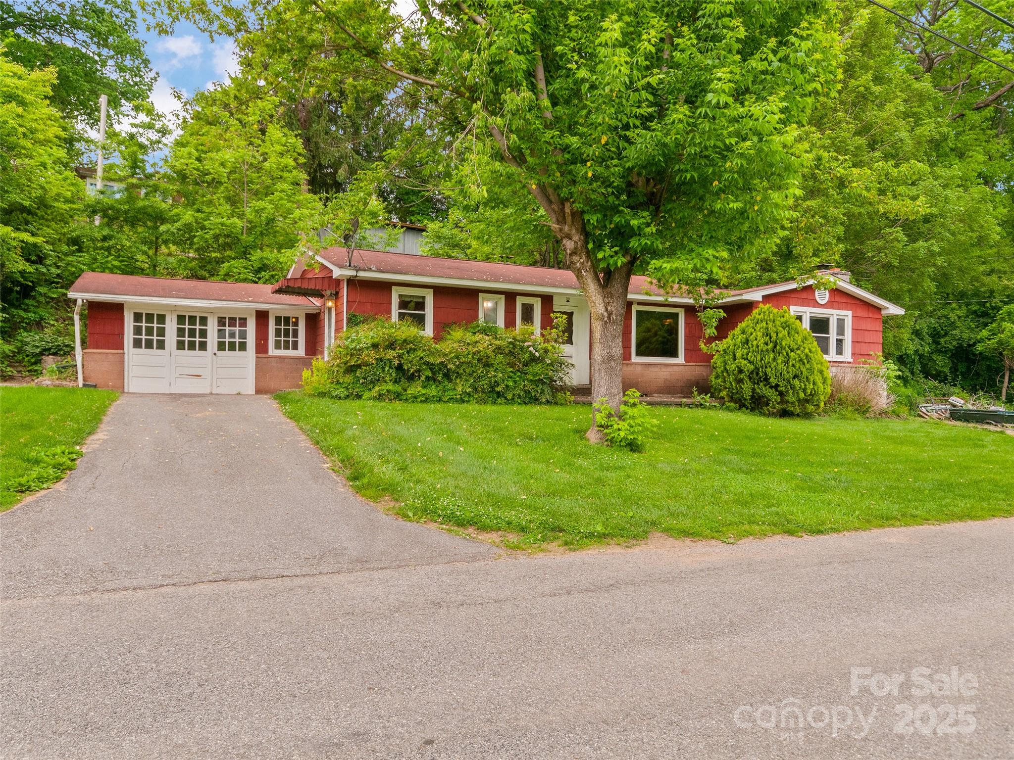 49 Caring Pl Loop Clyde, NC 28721 - Photo 2 of 18 front view of house with a yard