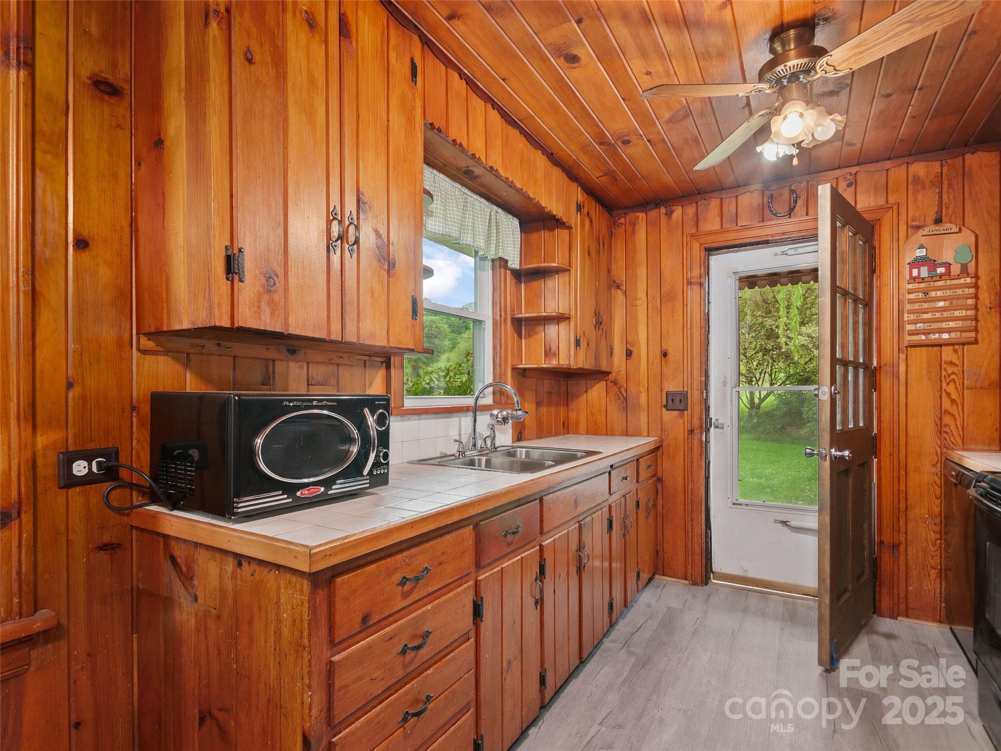 49 Caring Pl Loop Clyde, NC 28721 - Photo 4 of 18 a kitchen with a stove and a sink