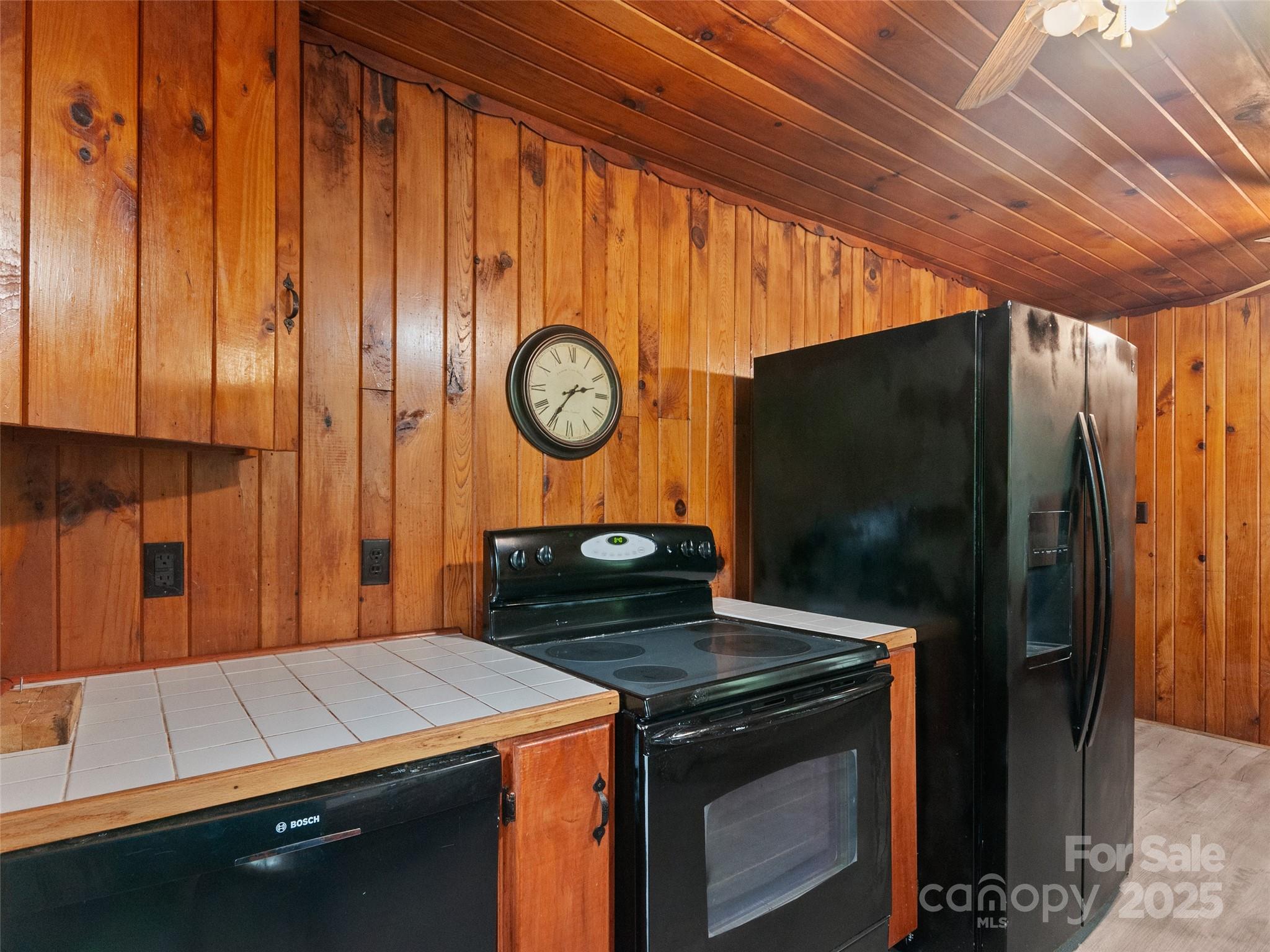 49 Caring Pl Loop Clyde, NC 28721 - Photo 5 of 18 a kitchen with a stove and a refrigerator