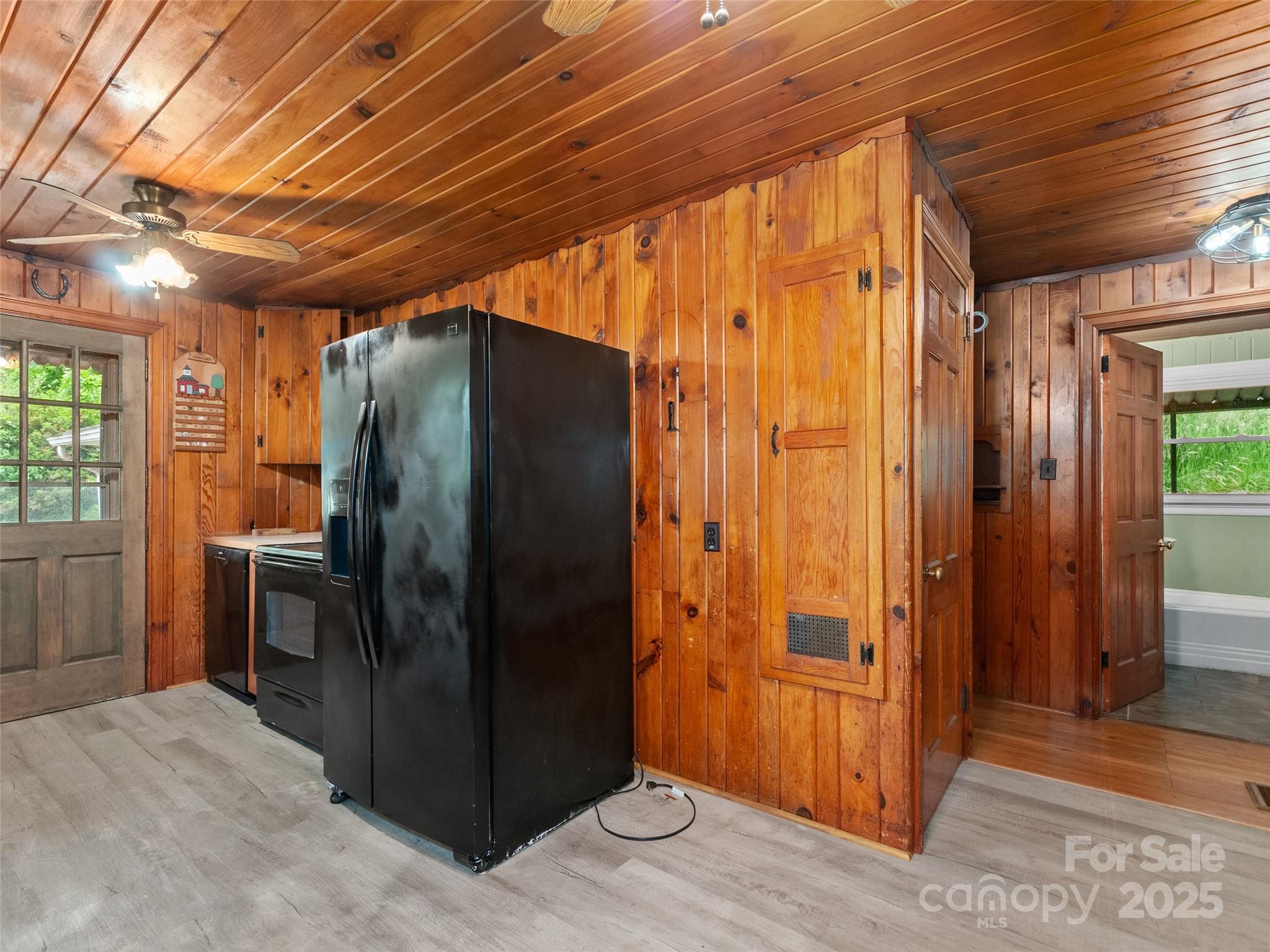 49 Caring Pl Loop Clyde, NC 28721 - Photo 6 of 18 an empty room with wooden floor and windows