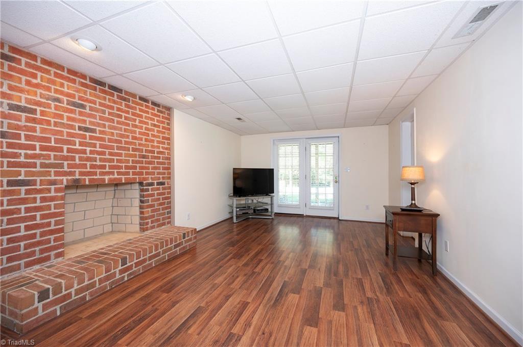 8930 Doubletree Lane Clemmons, NC 27012 - Photo 37 of 49 Basement Den Wood Burning Fireplace