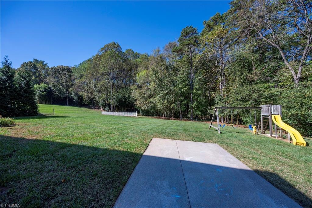 8930 Doubletree Lane Clemmons, NC 27012 - Photo 42 of 48 Side Yard w/Playset/Back Yard
