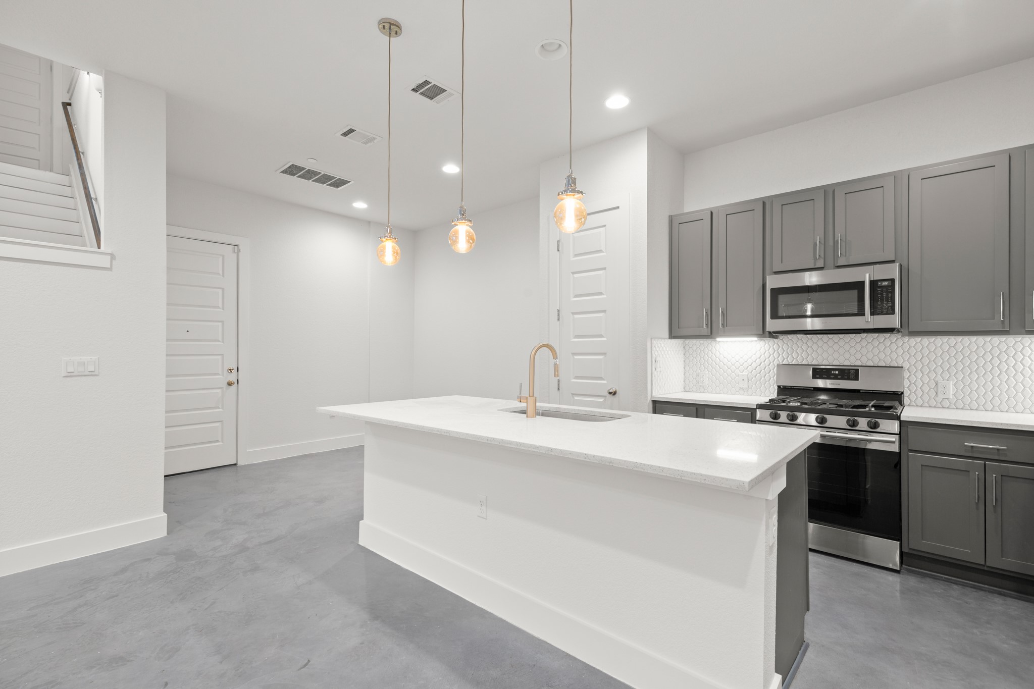 8922 Manchaca Road, Unit 701 Austin, TX 78748 - Photo 5 of 25 a kitchen with stainless steel appliances a sink stove and refrigerator