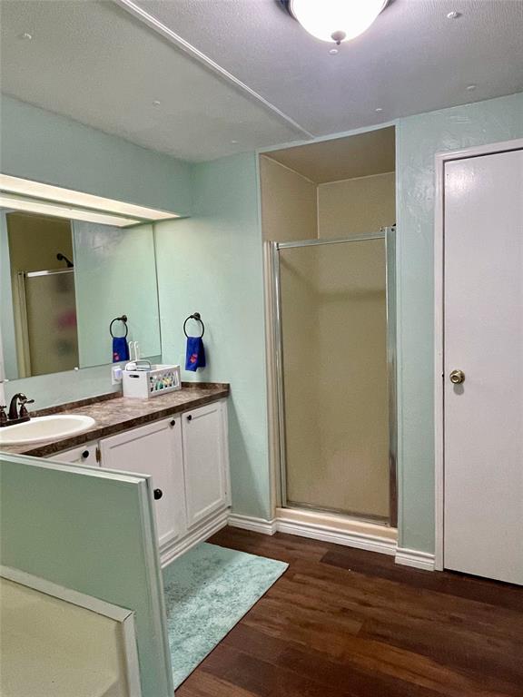 2334 San Bar Road, Unit 50 Graford, TX 76449 - Photo 24 of 40 a bathroom with a sink and a mirror