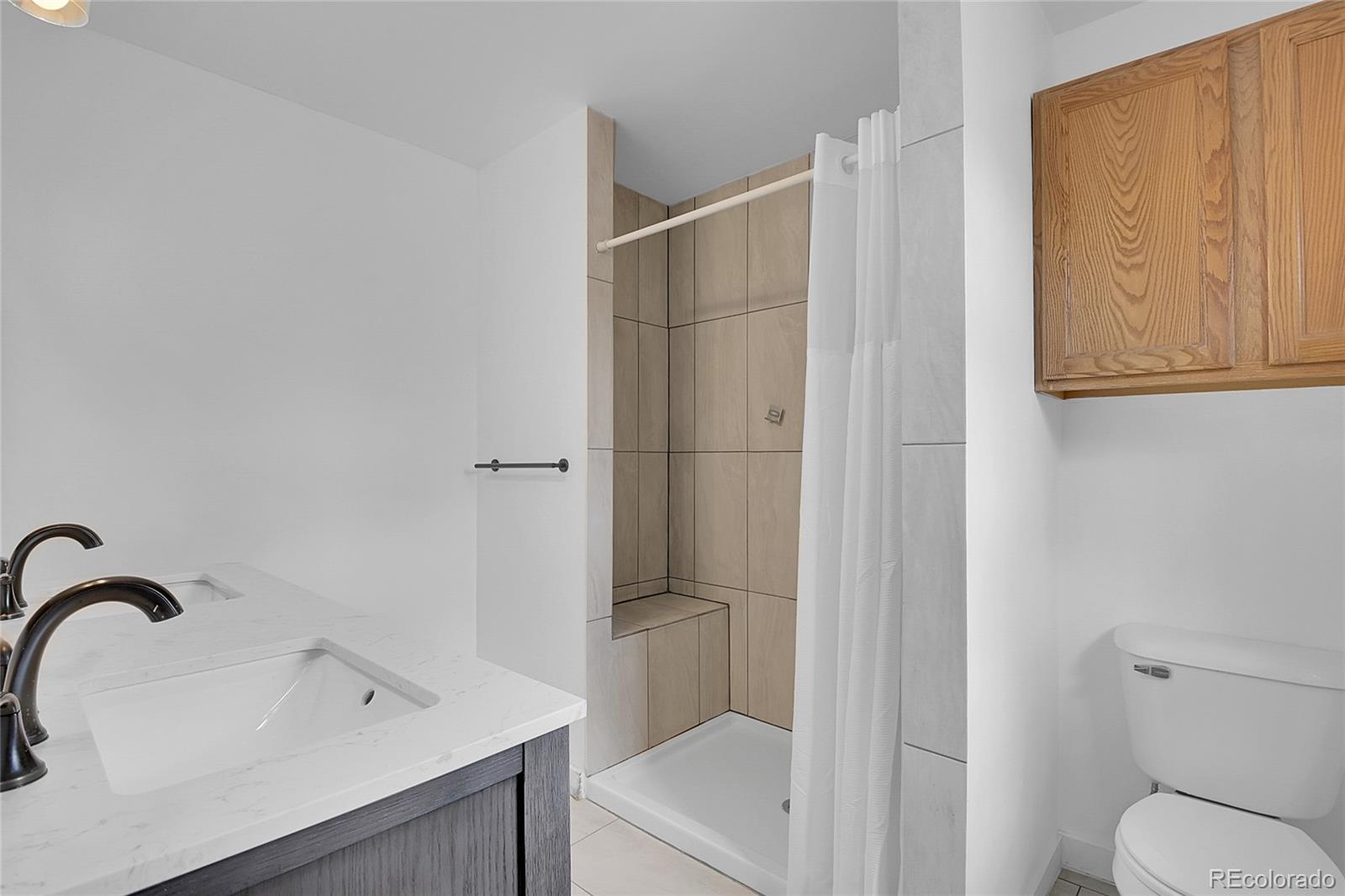 211 Chalet Drive Black Hawk, CO 80422 - Photo 12 of 36 a bathroom with a sink and a toilet