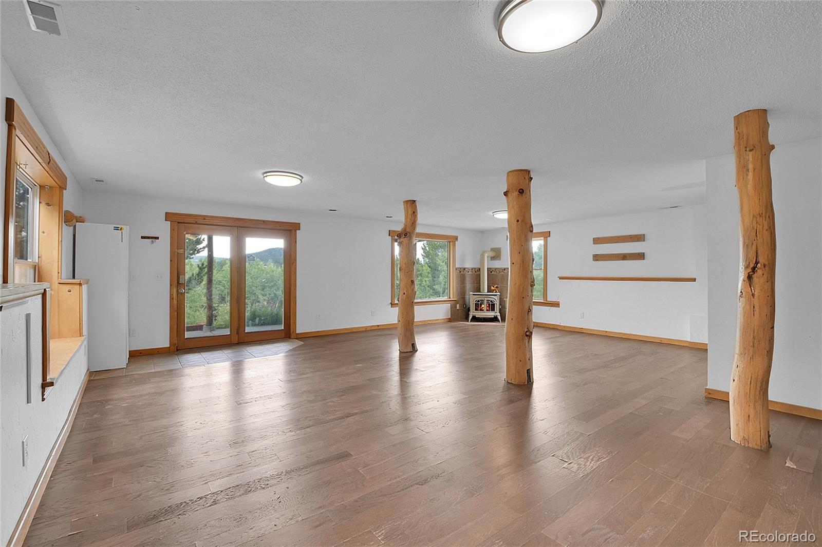 211 Chalet Drive Black Hawk, CO 80422 - Photo 17 of 36 a view of a livingroom with furniture wooden floor and window