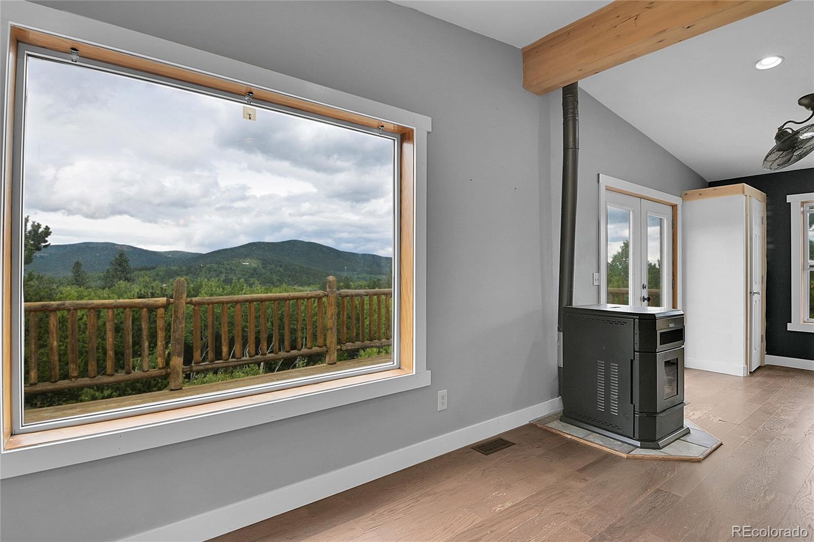 211 Chalet Drive Black Hawk, CO 80422 - Photo 9 of 36 a view of a door and chair in a room