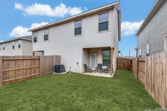 a front view of a house with garden and porch