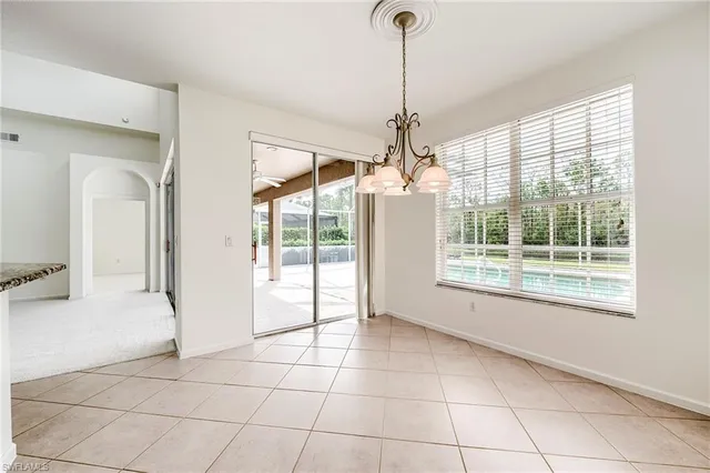 a view of a room window and wooden floor