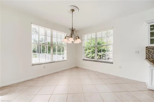 a view of an empty room with windows