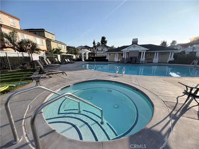 a building outdoor space with patio furniture and potted plants