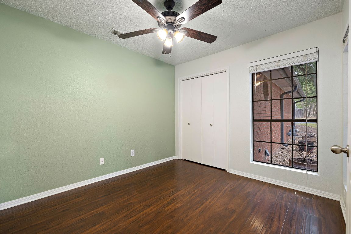 2013 Cervin Boulevard Austin, TX 78728 - Photo 14 of 31 a view of an empty room with window and wooden floor