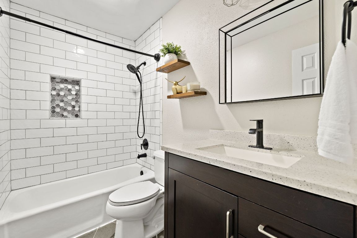 2013 Cervin Boulevard Austin, TX 78728 - Photo 17 of 31 a bathroom with a sink a toilet and shower