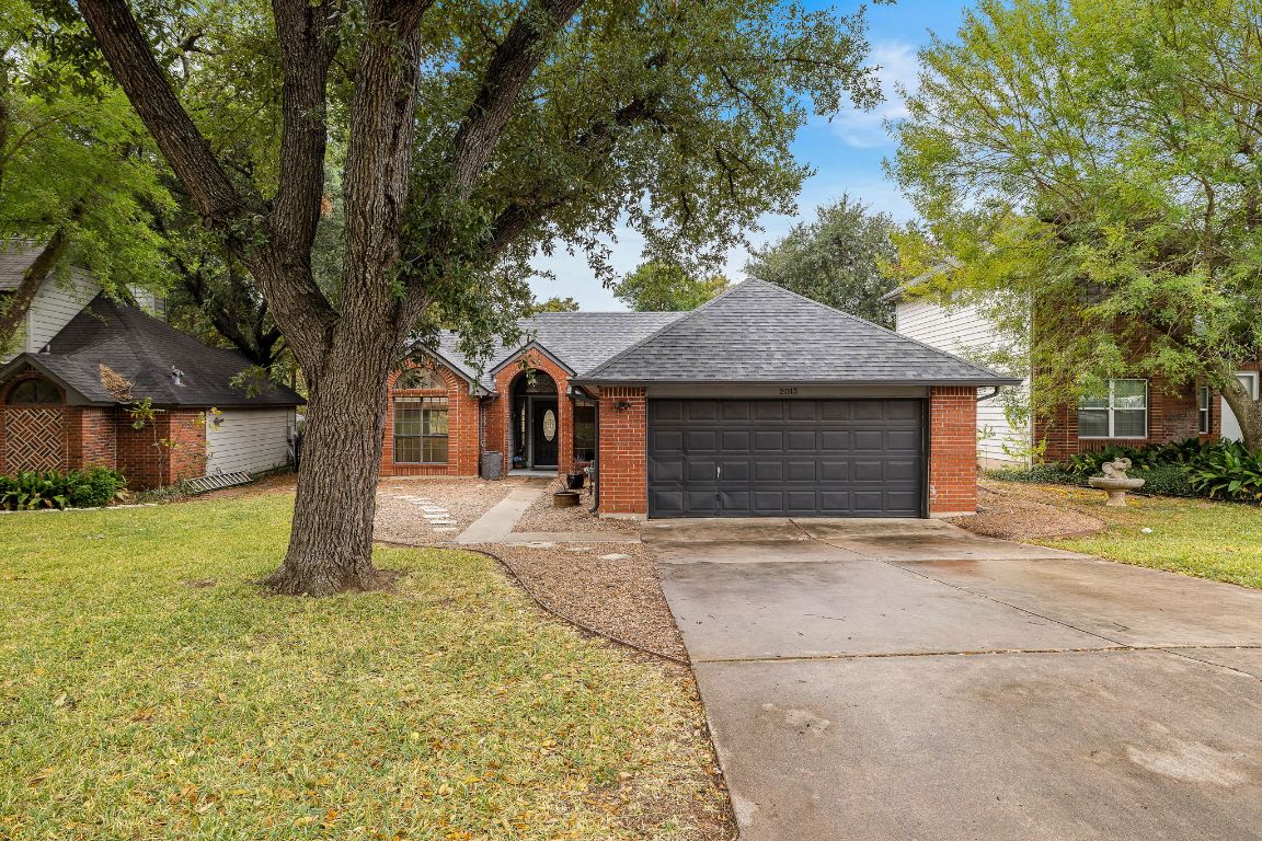 2013 Cervin Boulevard Austin, TX 78728 - Photo 2 of 31 a front view of a house with a garden