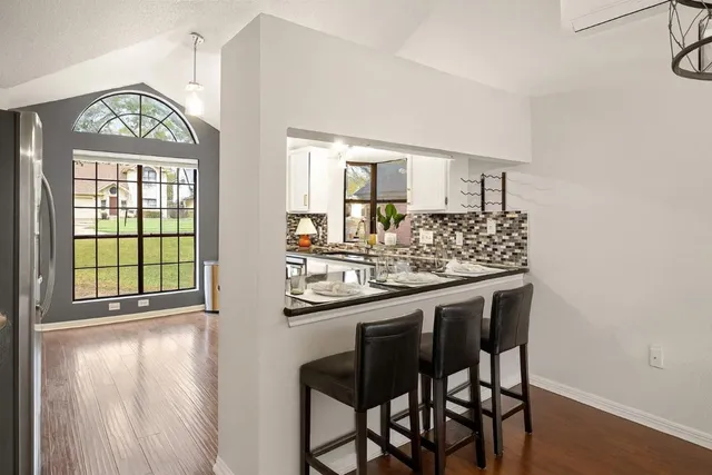 a kitchen with a table and chairs in it