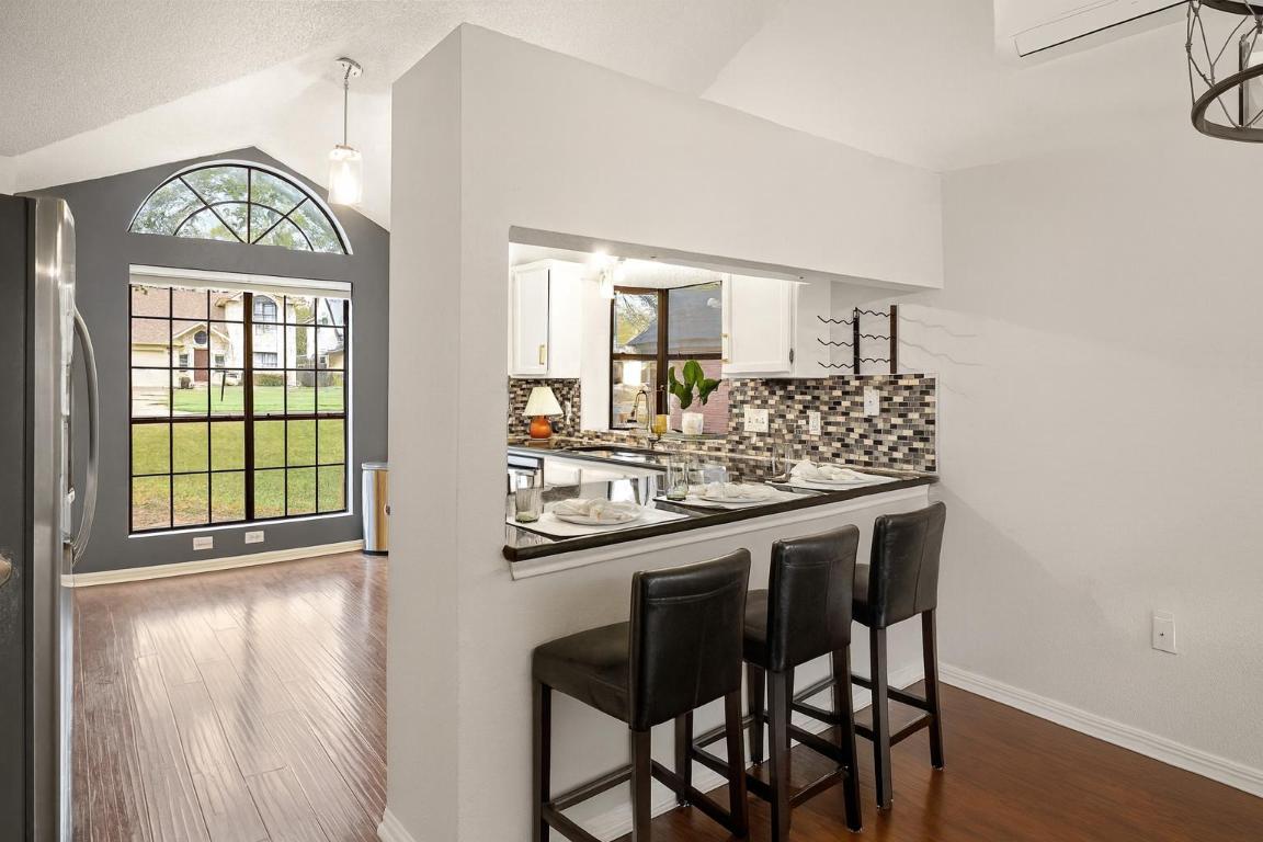2013 Cervin Boulevard Austin, TX 78728 - Photo 7 of 31 a kitchen with a table and chairs in it