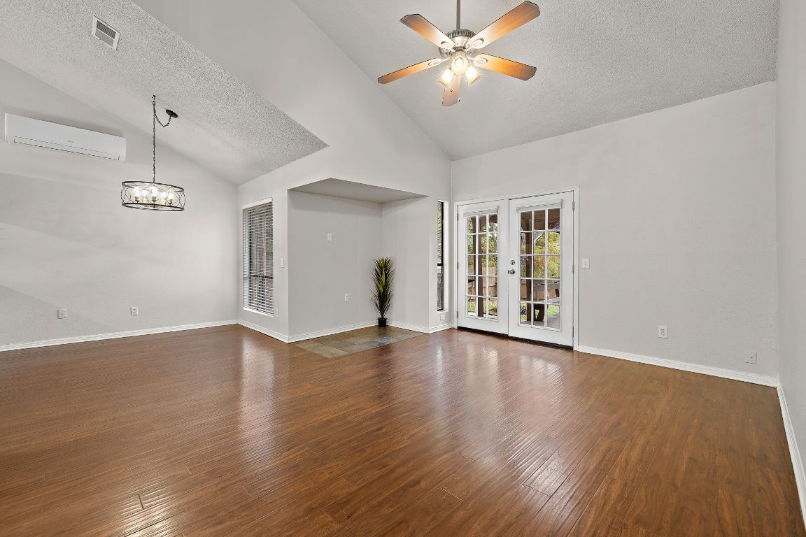 2013 Cervin Boulevard Austin, TX 78728 - Photo 8 of 31 a view of an empty room with window and wooden floor