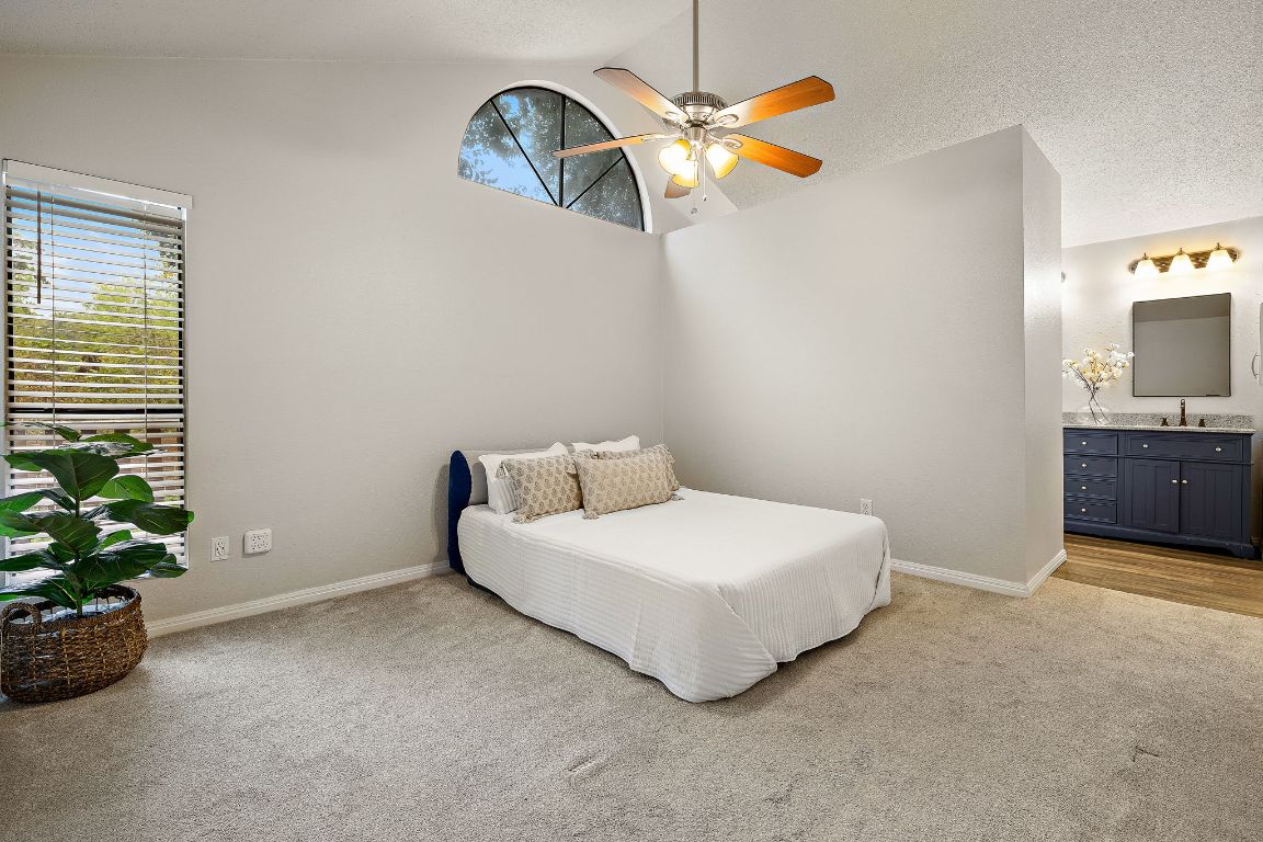 2013 Cervin Boulevard Austin, TX 78728 - Photo 10 of 31 a bedroom with a bed and a potted plant