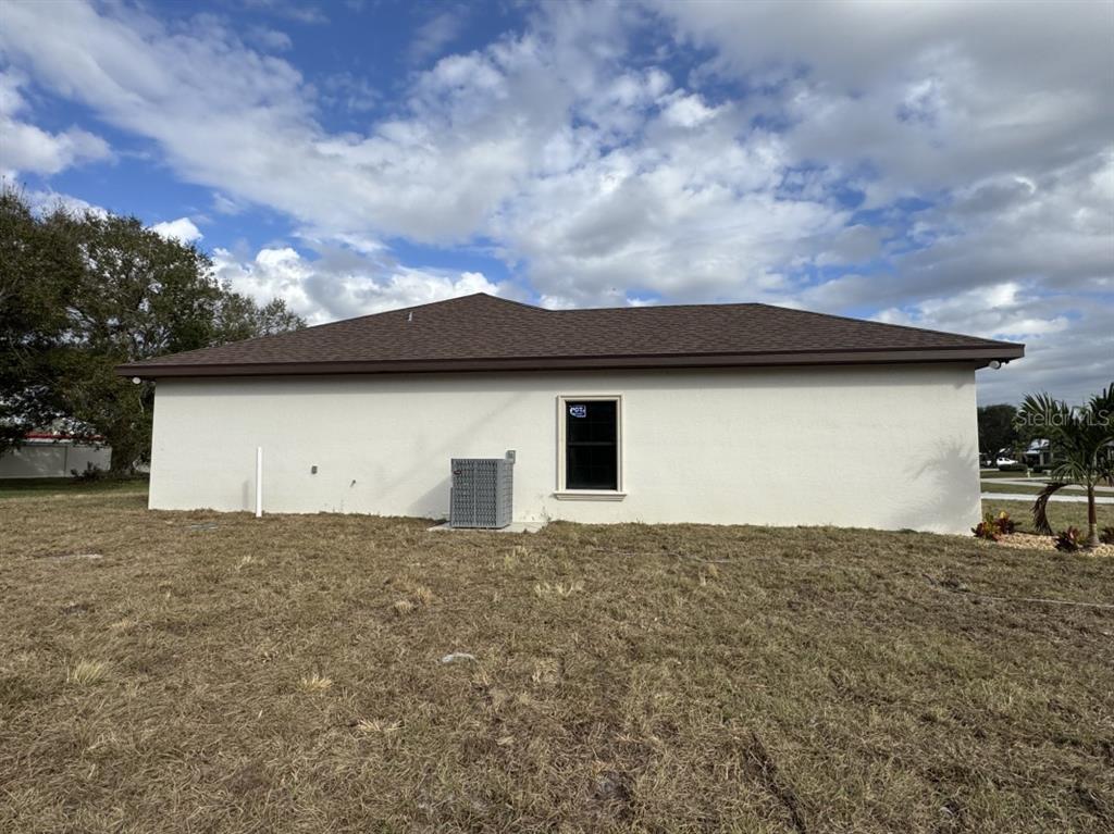 2383 Southwest 2nd Court Okeechobee, FL 34974 - Photo 12 of 48 a backyard of a house with lots of green space